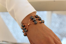 Load image into Gallery viewer, Hematite beaded bracelet wire wrapped in rose gold. Made in Austin Texas